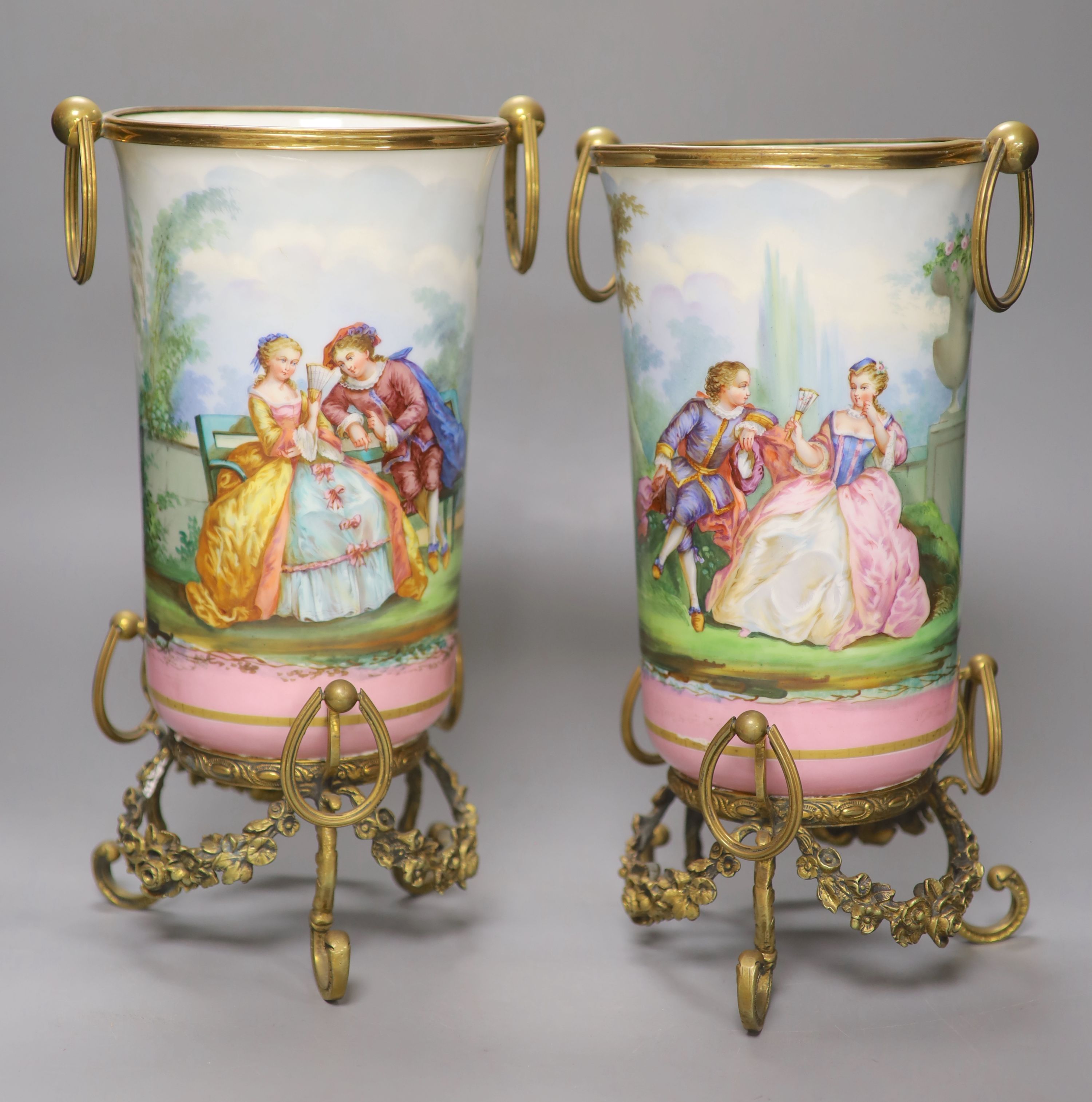 A pair of late 19th century Paris porcelain and gilt metal mounted vases, height 33cm